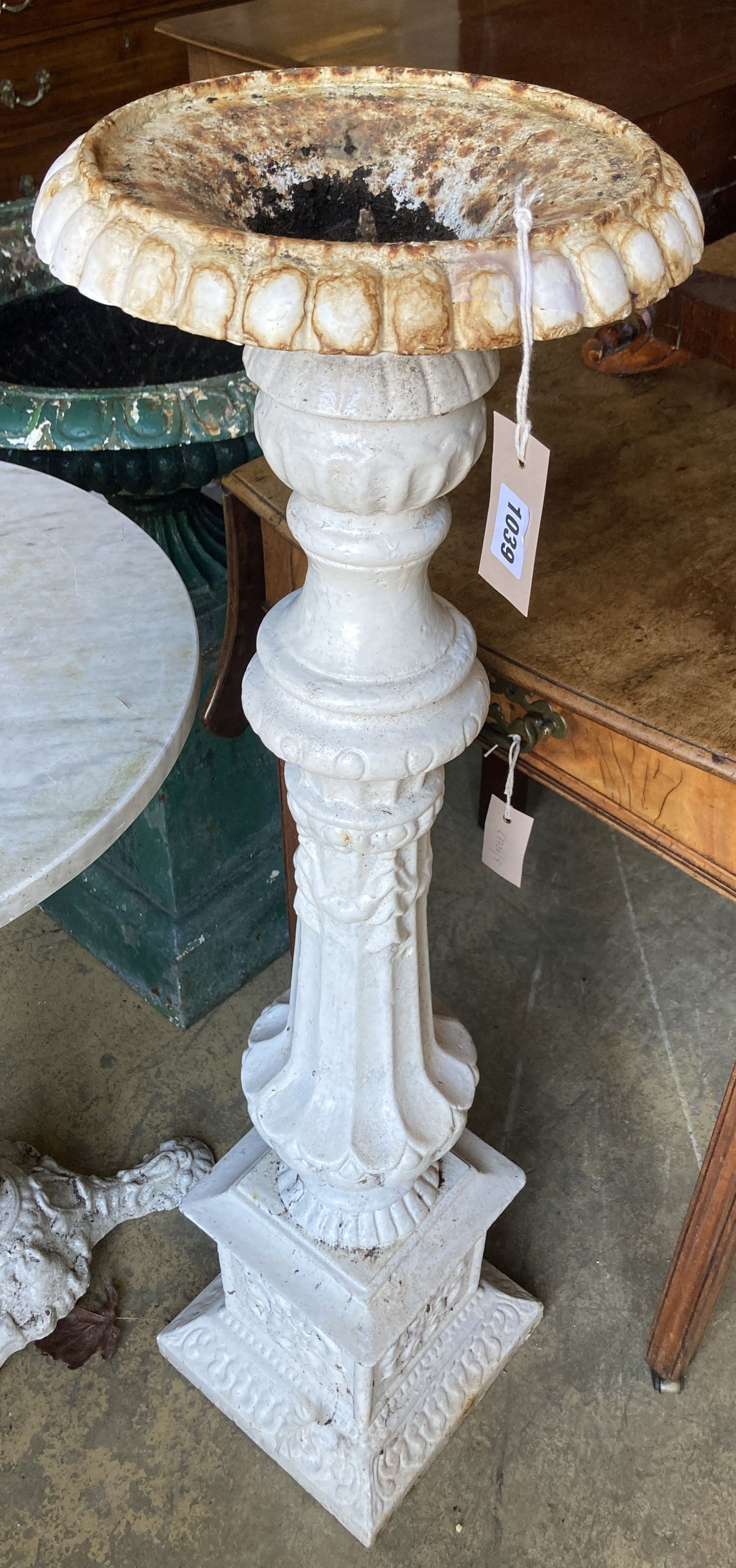 A Victorian white painted cast iron jardiniere stand, height 102cm